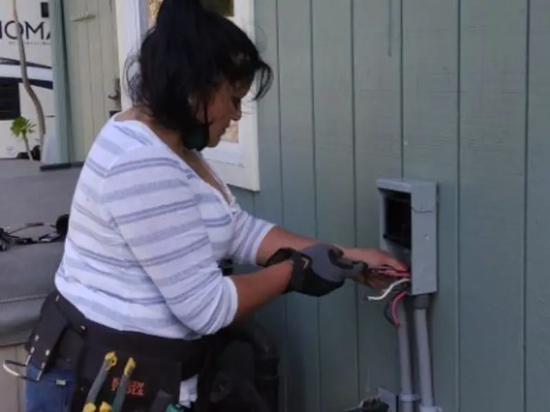 Licensed electrician wiring an exterior subpanel in Medina